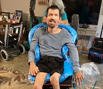 man in seated position chair
